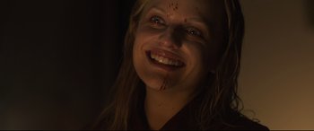 Movie still from “Us” (2019), directed by Jordan Peele – A person with blood on their face; Close Up shot, Low angle