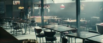 Movie still from “Horns” (2013), directed by Alexandre Aja – An empty restaurant with tables , chairs , and a pool table in the background; Wide shot, High angle