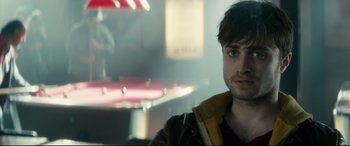 Movie still from “Horns” (2013), directed by Alexandre Aja – A person in a room near a pool table; Close Up shot, Over the shoulder angle