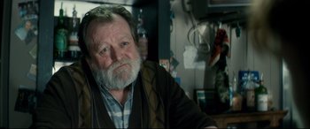 Movie still from “Horns” (2013), directed by Alexandre Aja – An older man with a beard and a mustache; Close Up shot, Over the shoulder angle