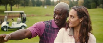 Movie still from “Horns” (2013), directed by Alexandre Aja – A man and a woman standing next to each other on a golf course; Close Up shot, High angle