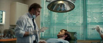 Movie still from “Horns” (2013), directed by Alexandre Aja – A doctor is talking to a man in a hospital bed; Medium shot, Over the shoulder angle