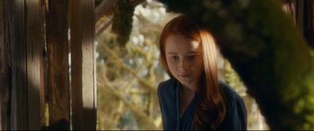 Movie still from “Horns” (2013), directed by Alexandre Aja – A woman with long red hair is looking at the camera; Close Up shot, Over the shoulder angle