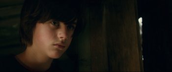 Movie still from “Horns” (2013), directed by Alexandre Aja – A person with long dark hair; Close Up shot, Low angle