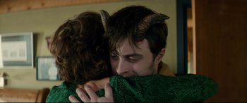 Movie still from “Horns” (2013), directed by Alexandre Aja – A man and a woman are hugging with horns on their heads; Close Up shot, Overhead angle