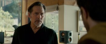 Movie still from “Horns” (2013), directed by Alexandre Aja – A person wearing a black shirt; Close Up shot, Low angle