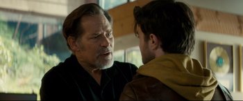 Movie still from “Horns” (2013), directed by Alexandre Aja – A man with a beard talking to another man; Close Up shot, Over the shoulder angle