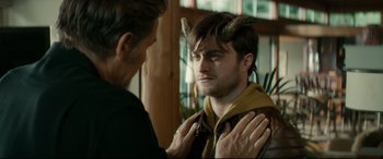 Movie still from “Horns” (2013), directed by Alexandre Aja – A man with horns on his head is looking at another man with horns on his head; Close Up shot, Over the shoulder angle