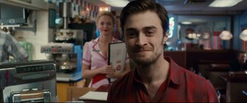 Movie still from “Horns” (2013), directed by Alexandre Aja – A man and a woman are smiling for the camera; Close Up shot, Over the shoulder angle