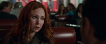 Movie still from “Horns” (2013), directed by Alexandre Aja – A woman with red hair sitting in a restaurant; Close Up shot, Over the shoulder angle