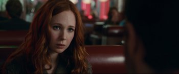 Movie still from “Horns” (2013), directed by Alexandre Aja – A person sitting in a chair; Close Up shot, Over the shoulder angle