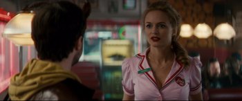 Movie still from “Horns” (2013), directed by Alexandre Aja – A woman in a pink shirt talking to another woman; Close Up shot, Over the shoulder angle