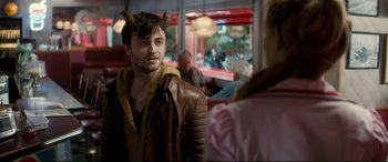 Movie still from “Horns” (2013), directed by Alexandre Aja – A man with horns on his head and a leather jacket on; Close Up shot, Over the shoulder angle
