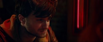 Movie still from “Horns” (2013), directed by Alexandre Aja – A person wearing a devil costume; Close Up shot, Over the shoulder angle