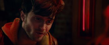 Movie still from “Horns” (2013), directed by Alexandre Aja – A person wearing a demon costume; Close Up shot, Over the shoulder angle