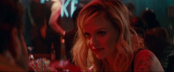 Movie still from “Horns” (2013), directed by Alexandre Aja – A beautiful blonde woman with a piercing on her nose; Close Up shot, Over the shoulder angle