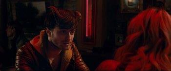 Movie still from “Horns” (2013), directed by Alexandre Aja – A man with horns on his head sitting in a room; Close Up shot, Over the shoulder angle