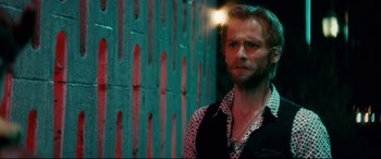 Movie still from “Horns” (2013), directed by Alexandre Aja – A man standing in front of a brick wall; Close Up shot, Low angle