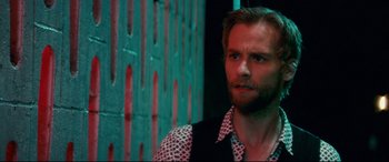 Movie still from “Horns” (2013), directed by Alexandre Aja – A person wearing a shirt and tie; Close Up shot, Over the shoulder angle