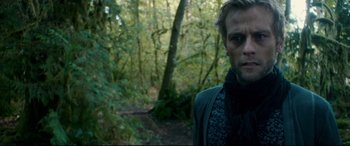 Movie still from “Horns” (2013), directed by Alexandre Aja – A man standing in the middle of a forest; Close Up shot, Over the shoulder angle