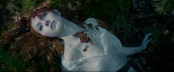 Movie still from “Horns” (2013), directed by Alexandre Aja – A doll laying in the grass covered in leaves; Close Up shot, Overhead angle
