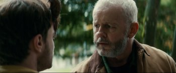 Movie still from “Horns” (2013), directed by Alexandre Aja – An older man with white hair talking to a younger man; Close Up shot, Over the shoulder angle