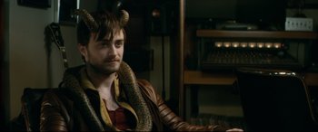 Movie still from “Horns” (2013), directed by Alexandre Aja – A man with horns on his head wearing a leather jacket; Close Up shot, High angle