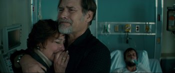 Movie still from “Horns” (2013), directed by Alexandre Aja – An older man and a younger woman in a hospital bed; Close Up shot, Over the shoulder angle