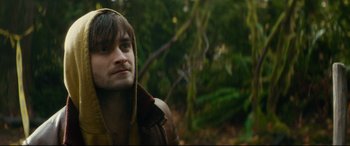 Movie still from “Horns” (2013), directed by Alexandre Aja – A man in a brown jacket is standing in the woods; Close Up shot, Low angle