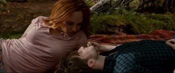 Movie still from “Horns” (2013), directed by Alexandre Aja – A man laying on the ground next to a woman; Medium shot, Overhead angle