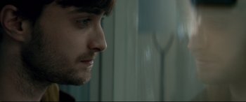 Movie still from “Horns” (2013), directed by Alexandre Aja – A man's face in front of a window; Close Up shot, Over the shoulder angle