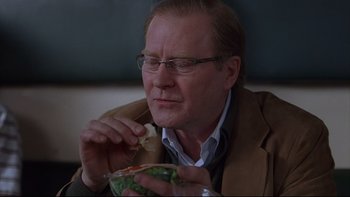 Movie still from “Hostel” (2005), directed by Eli Roth – A person eating a salad; Close Up shot, Over the shoulder angle