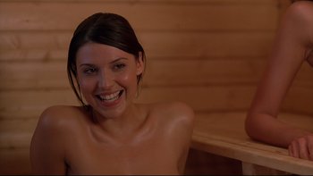 Movie still from “Hostel” (2005), directed by Eli Roth – A beautiful young woman sitting in a sauna; Close Up shot, Over the shoulder angle