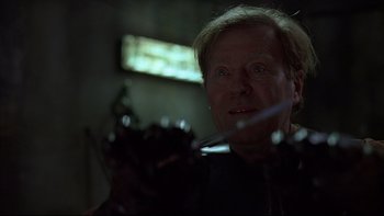 Movie still from “Hostel” (2005), directed by Eli Roth – A person in a dark room; Close Up shot, Low angle