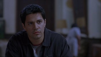 Movie still from “Hostel” (2005), directed by Eli Roth – A person sitting in a room; Close Up shot, High angle
