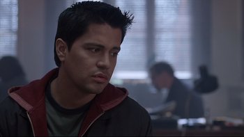 Movie still from “Hostel” (2005), directed by Eli Roth – A young man is looking to his left; Close Up shot, Over the shoulder angle