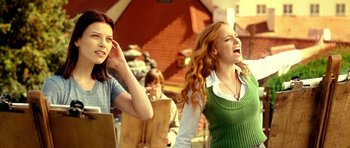 Movie still from “Hostel: Part II” (2007), directed by Eli Roth – Two young women standing next to each other; Medium shot, Low angle