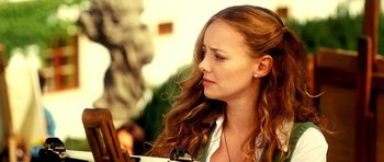 Movie still from “Hostel: Part II” (2007), directed by Eli Roth – A beautiful young lady looking at her reflection in a mirror; Close Up shot, Low angle