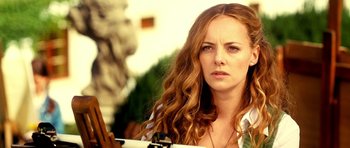 Movie still from “Hostel: Part II” (2007), directed by Eli Roth – A beautiful young woman with long , red hair; Close Up shot, Low angle