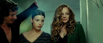 Movie still from “Hostel: Part II” (2007), directed by Eli Roth – Two beautiful young women standing next to each other; Close Up shot, Low angle