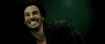 Movie still from “Hostel: Part II” (2007), directed by Eli Roth – A person smiling with his mouth wide open; Close Up shot, Overhead angle