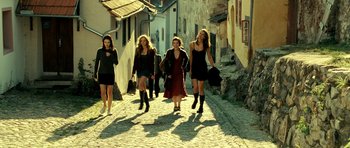 Movie still from “Hostel: Part II” (2007), directed by Eli Roth – A group of women walking down a street; Wide shot, Low angle