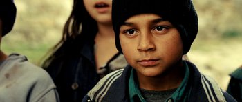 Movie still from “Hostel: Part II” (2007), directed by Eli Roth – A boy and a girl are looking at the camera; Close Up shot, Over the shoulder angle