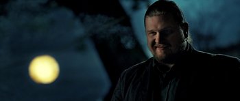 Movie still from “Hostel: Part II” (2007), directed by Eli Roth – A person with a beard; Close Up shot, Low angle