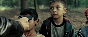 Movie still from “Hostel: Part II” (2007), directed by Eli Roth – Two young boys looking at something in the distance; Close Up shot, Over the shoulder angle