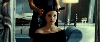 Movie still from “Hostel: Part II” (2007), directed by Eli Roth – A woman getting her hair done by a hair dresser; Close Up shot, Over the shoulder angle