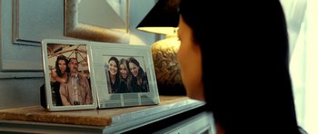 Movie still from “Hostel: Part II” (2007), directed by Eli Roth – A picture of three girls in a picture frame; Extreme Close Up shot, Over the shoulder angle