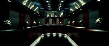 Movie still from “Hostel: Part II” (2007), directed by Eli Roth – A group of skulls in a room with a mirror; Wide shot, Overhead angle