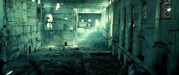 Movie still from “Hostel: Part II” (2007), directed by Eli Roth – An abandoned building with lots of rubble in it; Extreme Wide shot, High angle