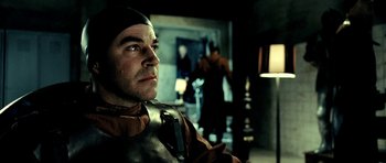 Movie still from “Hostel: Part II” (2007), directed by Eli Roth – A person wearing a helmet; Close Up shot, Over the shoulder angle